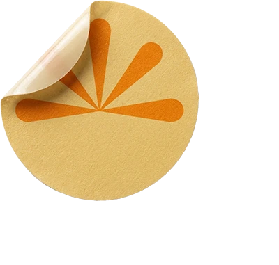 A round Luvora belly button patch with a sun design